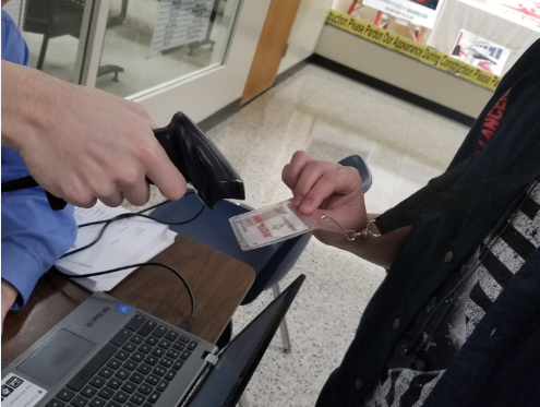 LRHS student getting their ID scanned in the hallway