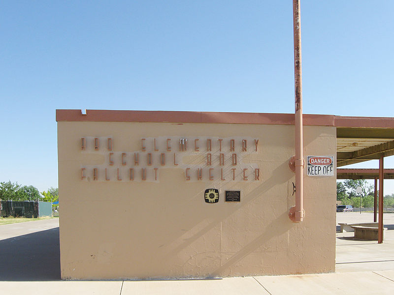 Abo Elementary School and Fallout Shelter. This former school was built completely underground. The photo shows a small entrance structure (doors are on the other side). According to the plaques on the front, the school was built in 1962 and is a New Mexico Registered Cultural Property and is on the National Register of Historic Places.