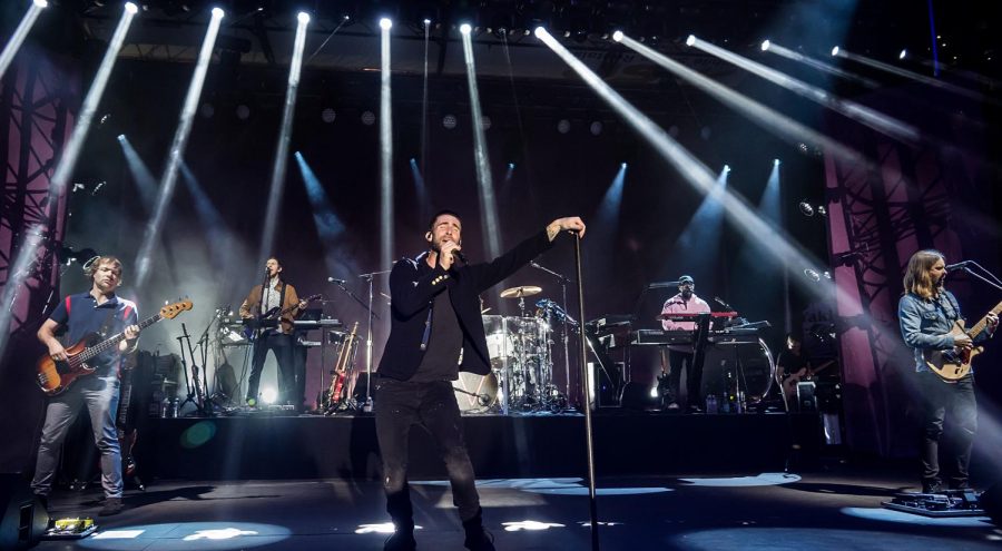 Maroon 5 lead singer Adam Levine in his signature, boring performance poise. 