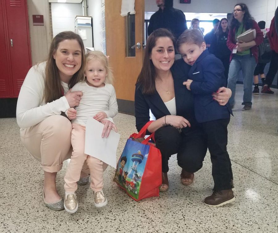 Ms. Spoelstra and Ms. Cawley, English teachers, stop for a photo with their mini-mes, Everly and Jack both 3).