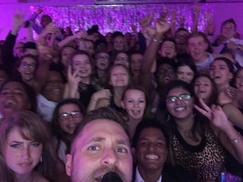Mr. Novak in one of his trademark selfies with students at the Homecoming Dance!