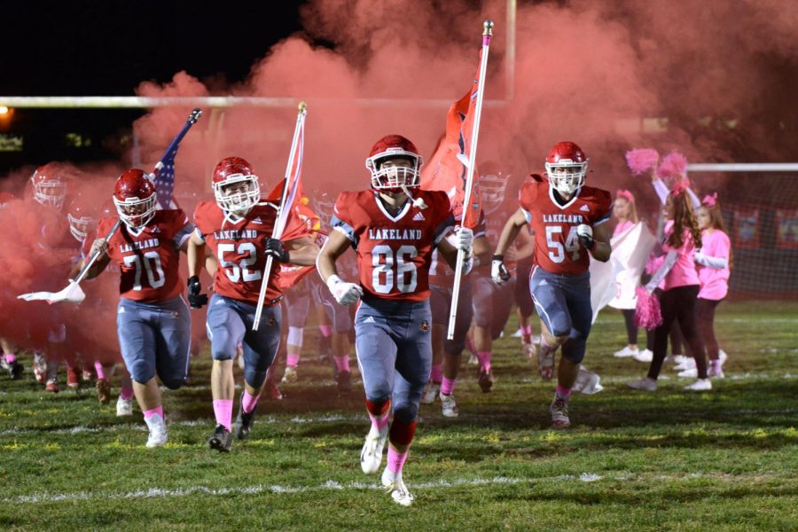 The Lancers entering the field during the pink-out game.