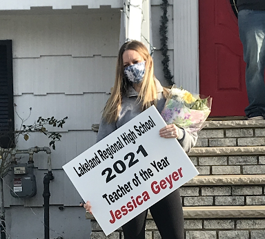 Ms. Geyer in her front yard after being surprised with the news.