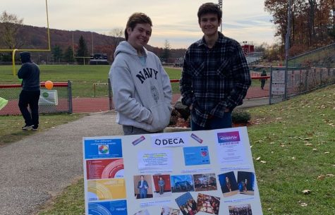DECA members Jack Burke and Ryan Caporusso ready to share information about Cookies for Cancers cause at the start of the Walkathon. 