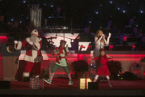 Mariah Carey, performing here in 2013, is the queen of Christmas hits, with her 1994 classic All I Want for Christmas is You still hits #1 during the holidays. 
