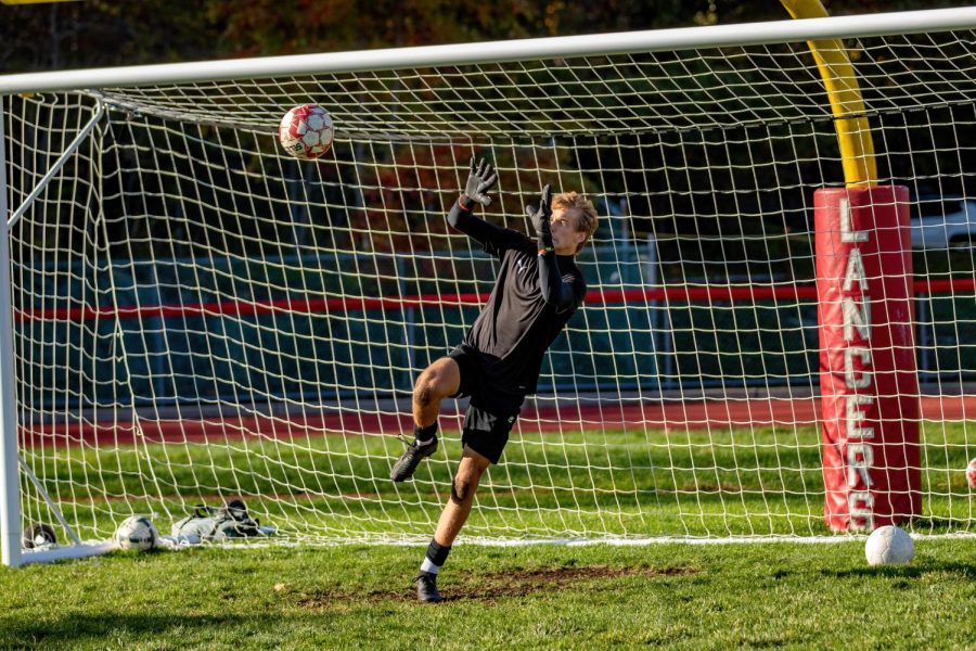 Junior Victor Ciach makes a great save to prevent the goal.