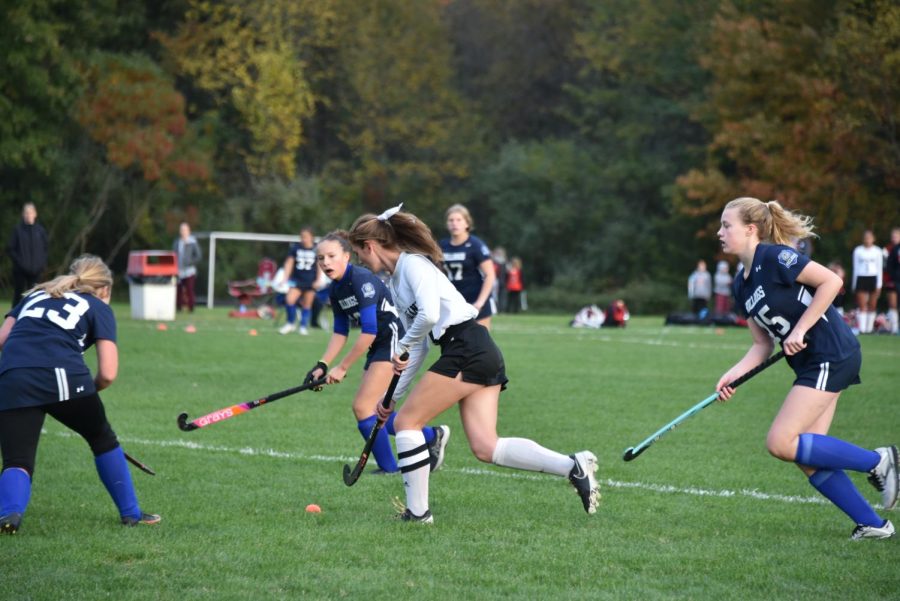 Lady Lancers fight for possession of ball.