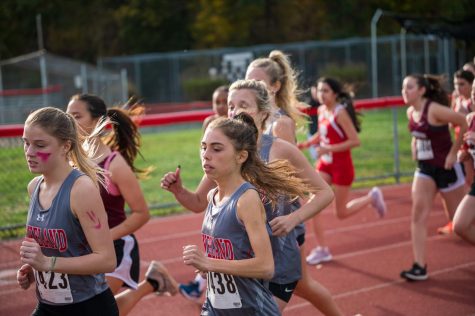 The girls and boys cross country teams, including senior captain Morgan Uhlhorn pictured here, ran to success this season.