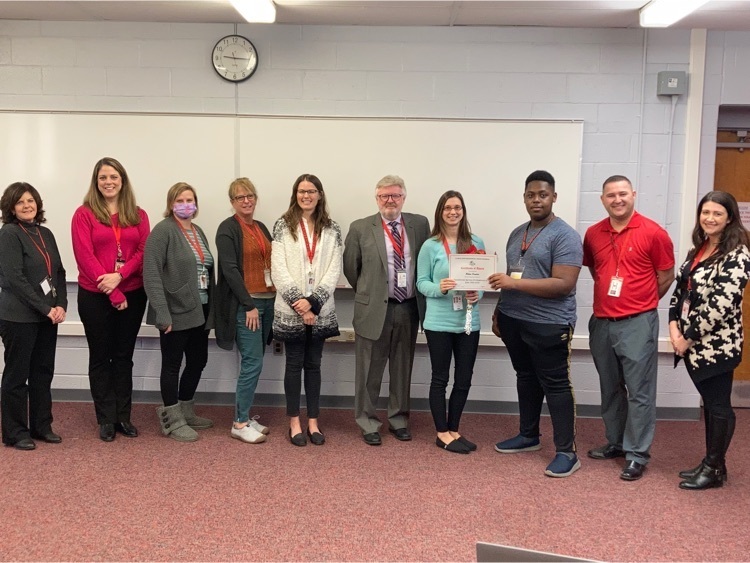 Ms. Bronstein (second from left) after being surprised with her award. 