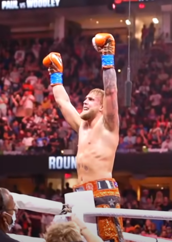 Jake Paul celebrates following his victory over Tyron Woodley in 2021.