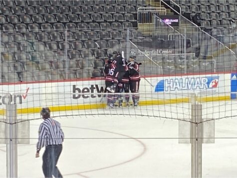 The Lancers score a goal and celebrate as a team.