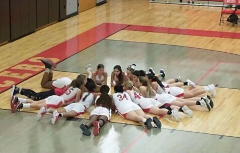 The girls doing one of their before game bonding rituals and hyping each other up.