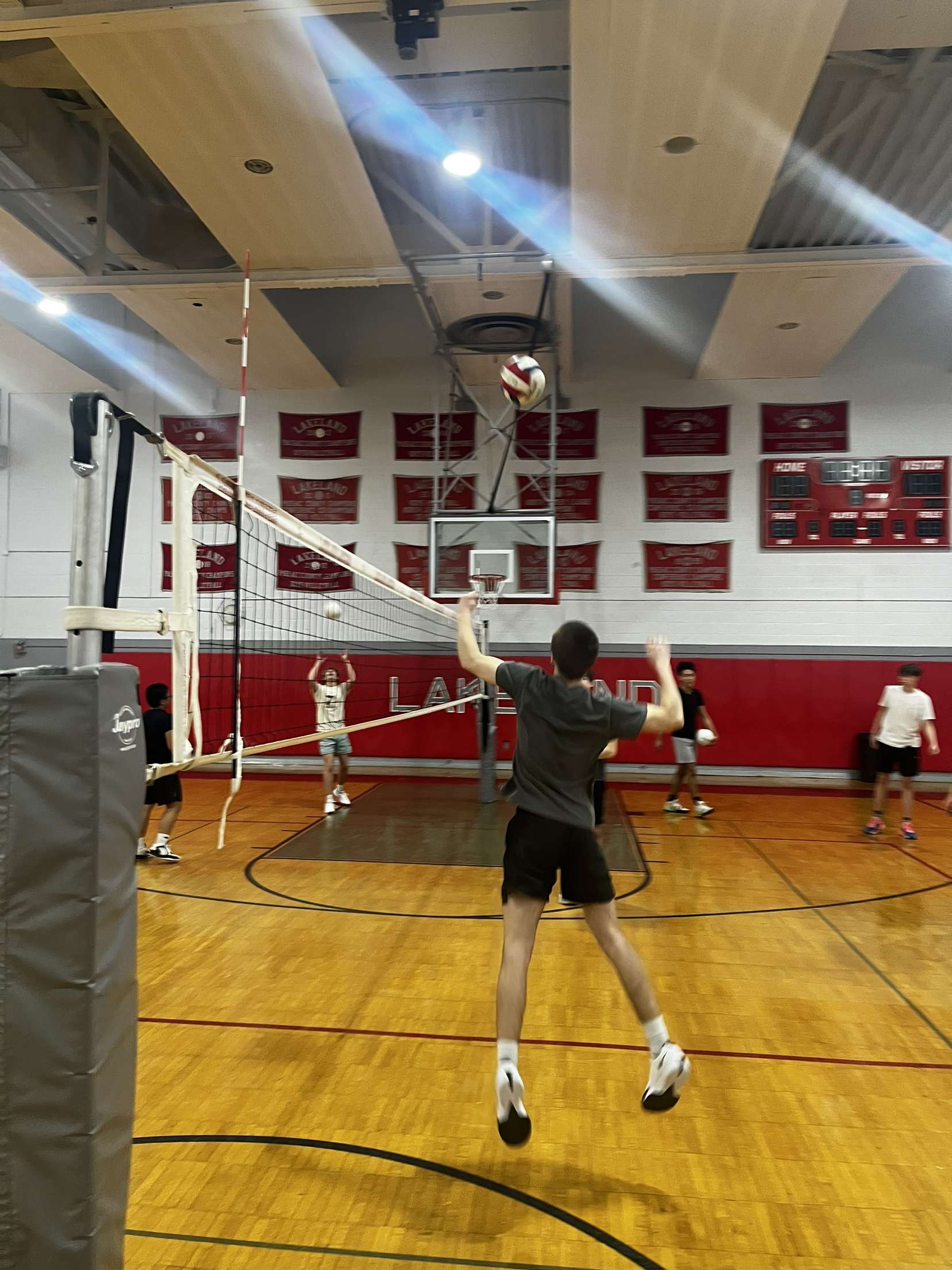 The boys spend their practice time wisely by focusing on their passing & spiking drills.