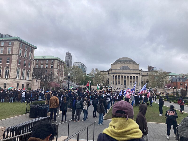 Students+protesting+at+Columbia+University+on+April+18%2C+2024%2C+after+the+first+student+encampment+was+removed+and+students+were+arrested+by+the+NYPD.+One+group+waves+Palestinian+flags+and+another+gorup+waves+Israeli+and+United+States+of+America+flags.+Low+Library+is+in+the+background.