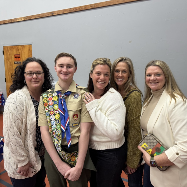 Jake Spellman after his eagle court of honor. Wearing his eagle slide and neckerchief. 

(LRHS)