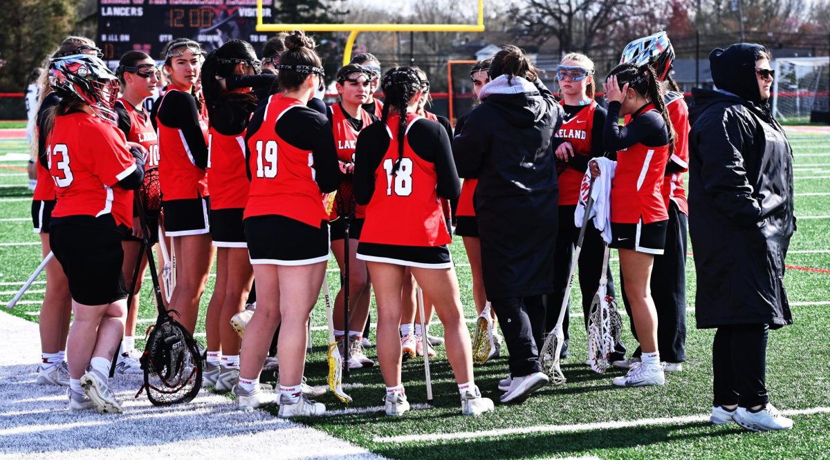 Lakeland girls lacrosse in a team huddle.

(LRHS)