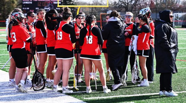 Lakeland girls lacrosse in a team huddle.

(LRHS)