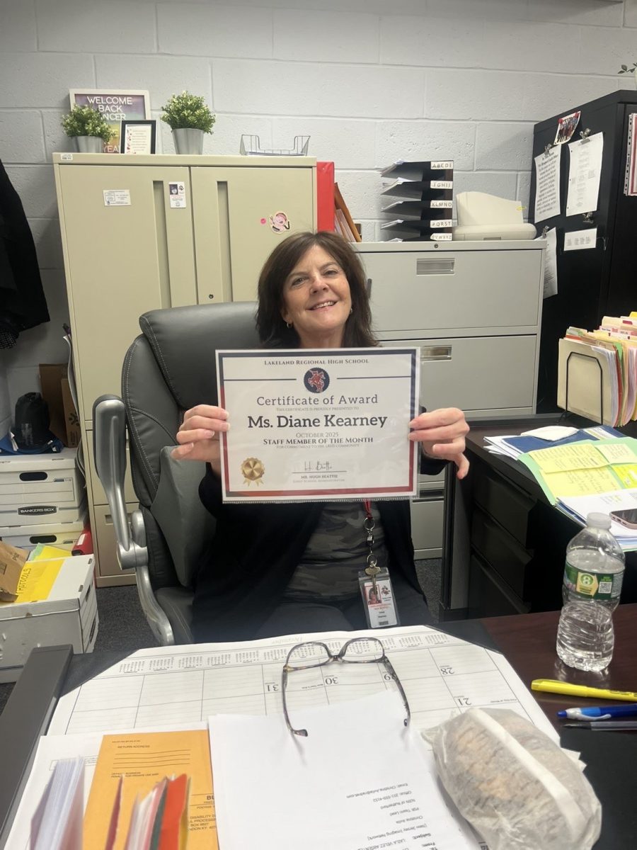 Ms. Diane Kearney proudly displays her Administrative Assistant of the Month Award. 

Photo courtesy of Ava Radice 