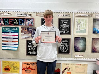 Sophomore Chase Phillips proudly displays his Student of the Month award. 

Photo courtesy of the Lancer Ledger Staff. 