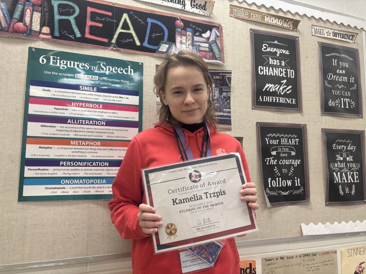 Senior Kamelia Trpzis poses with her Student of the Month Award for math. 