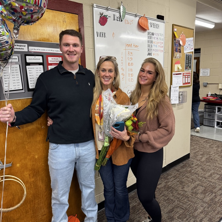 Ms. Karen McCormack celebrates her award as Teacher of the Year with a surprise visit from two special Lakeland alumni- her kids! 
