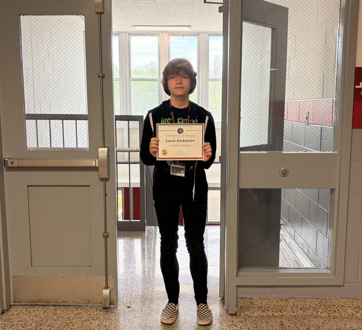 Lucas Alekseyev proudly accepts his award as Student of the Month for Spanish class. 

Photo courtesy of Dalia Salem